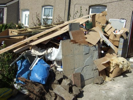 Workers removing items from a terraced house in Rotherhithe